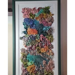 Thumbnail: clay textures in a variety of bold colours including purples, blues, greens, oranges, and pinks. Thumbnail: clay textures in a variety of bold colours including purples, blues, greens, oranges, and pinks. Thumbnail: clay textures in a variety of bold colours including purples, blues, greens, oranges, and pinks. Thumbnail: ange, purple, blue, and green, with highly detailed surface patterns and depth. Thumbnail: clay textures in a variety of bold colours including purples, blues, greens, oranges, and pinks. Thumbnail: clay textures in a variety of bold colours including purples, blues, greens, oranges, and pinks. Thumbnail: clay textures in a variety of bold colours including purples, blues, greens, oranges, and pinks. Original 3D Mixed Media Artwork – Air-Dry Clay, Acrylic, Varnish | Framed | For Sale Dive into a colourful underwater world with Kaleidoscope — a vibrant, textural artwork inspired by the rich beauty of coral reefs. Hand-sculpted from air-dry clay and painted in layers of acrylic, this piece bursts with playful shapes, bold colours, and ocean-inspired forms that seem to dance across the surface. Every detail is created by hand, bringing to life the organic variety of marine textures — from soft sea sponges and anemones to clusters of coral and imagined reef life. Finished with a protective varnish and professionally framed, it’s ready to brighten any space. Perfect for ocean lovers, collectors of unique art, or anyone drawn to tactile, nature-inspired creations. Kaleidoscope - 3D textured mixed media wall art