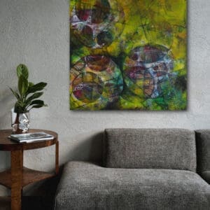 Painting hung above a sofa